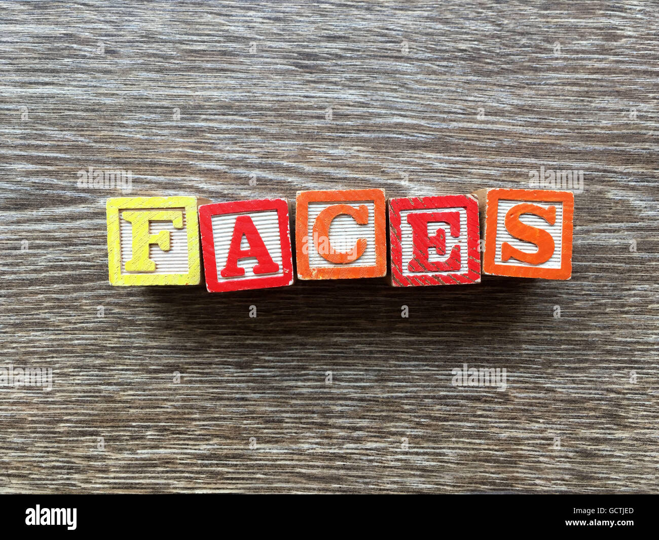 FACES word written with wood block letter toys Stock Photo