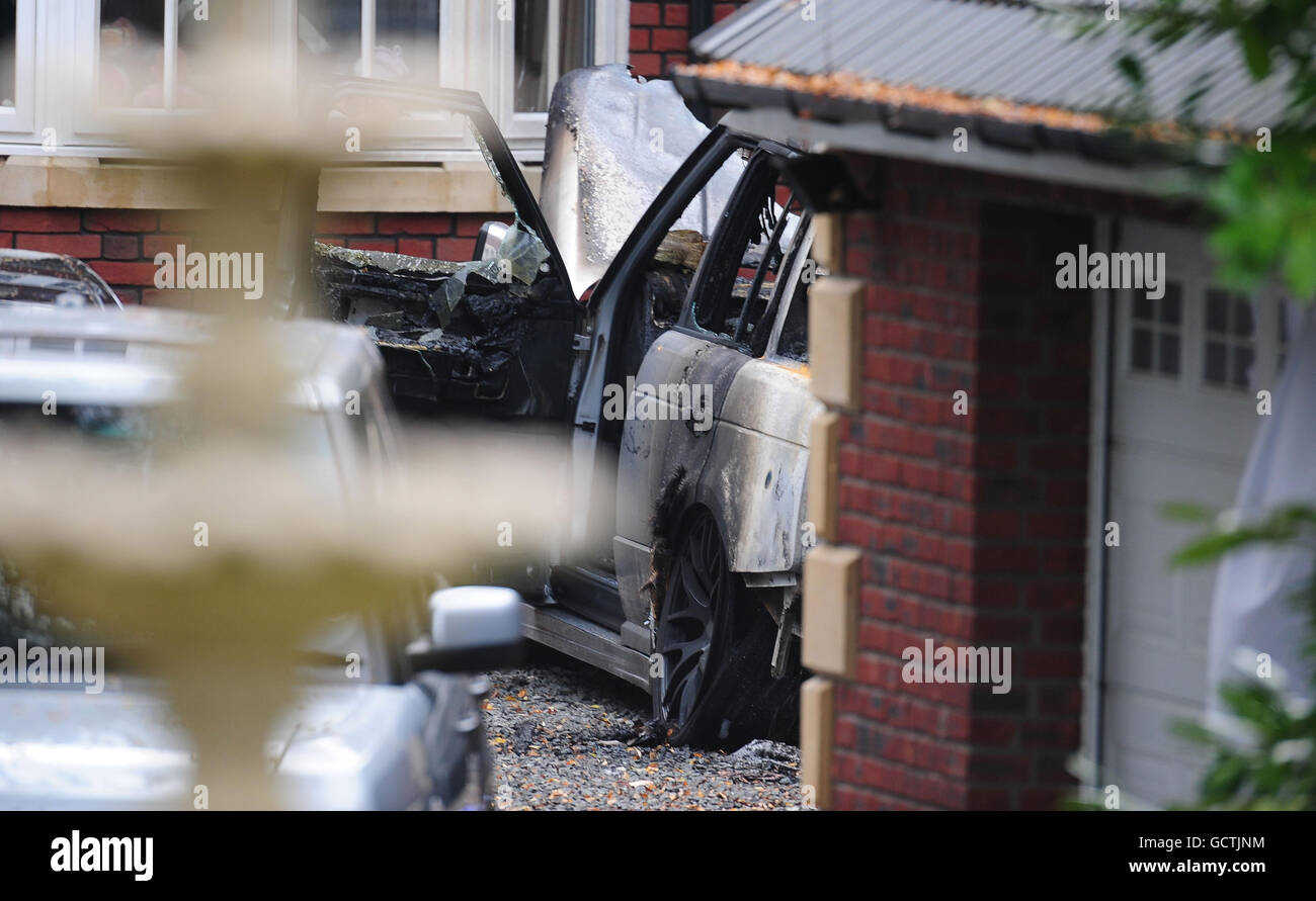 The burnt out chrome plated Range Rover at Kevin Nolan's house ...