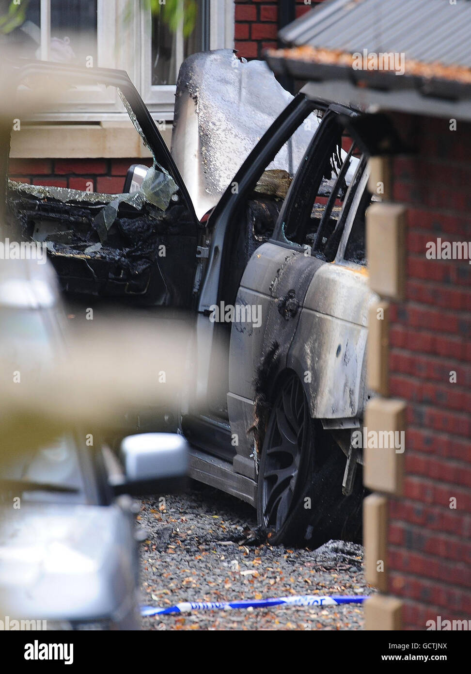 The burnt out chrome plated Range Rover at Kevin Nolan's house ...