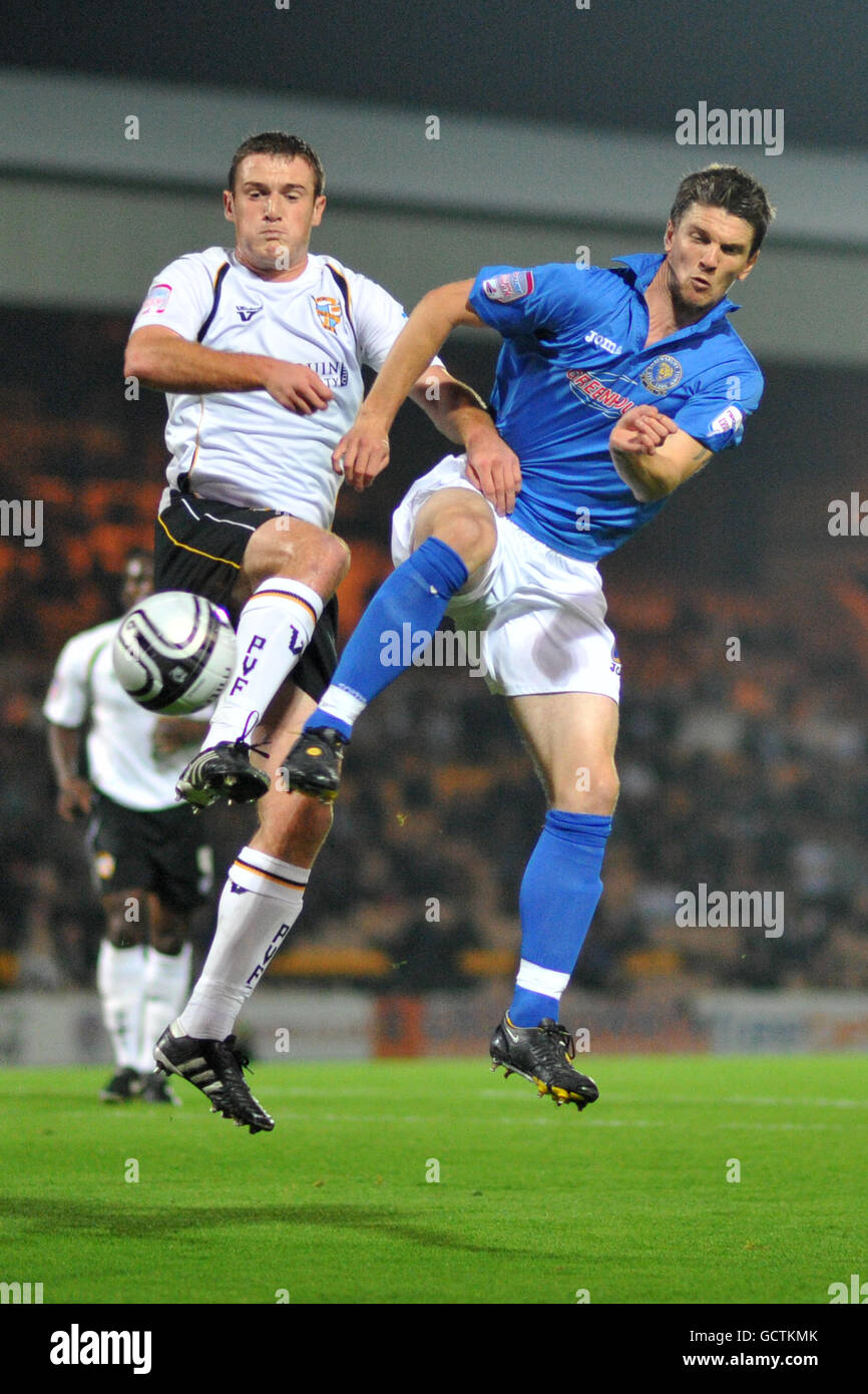 Soccer - npower League Two - Port Vale v Shrewsbury Town - Vale Park. Port Vale's Lee Collins (left) and Shrewsbury Town's Shane Sherriff battle for the ball Stock Photo