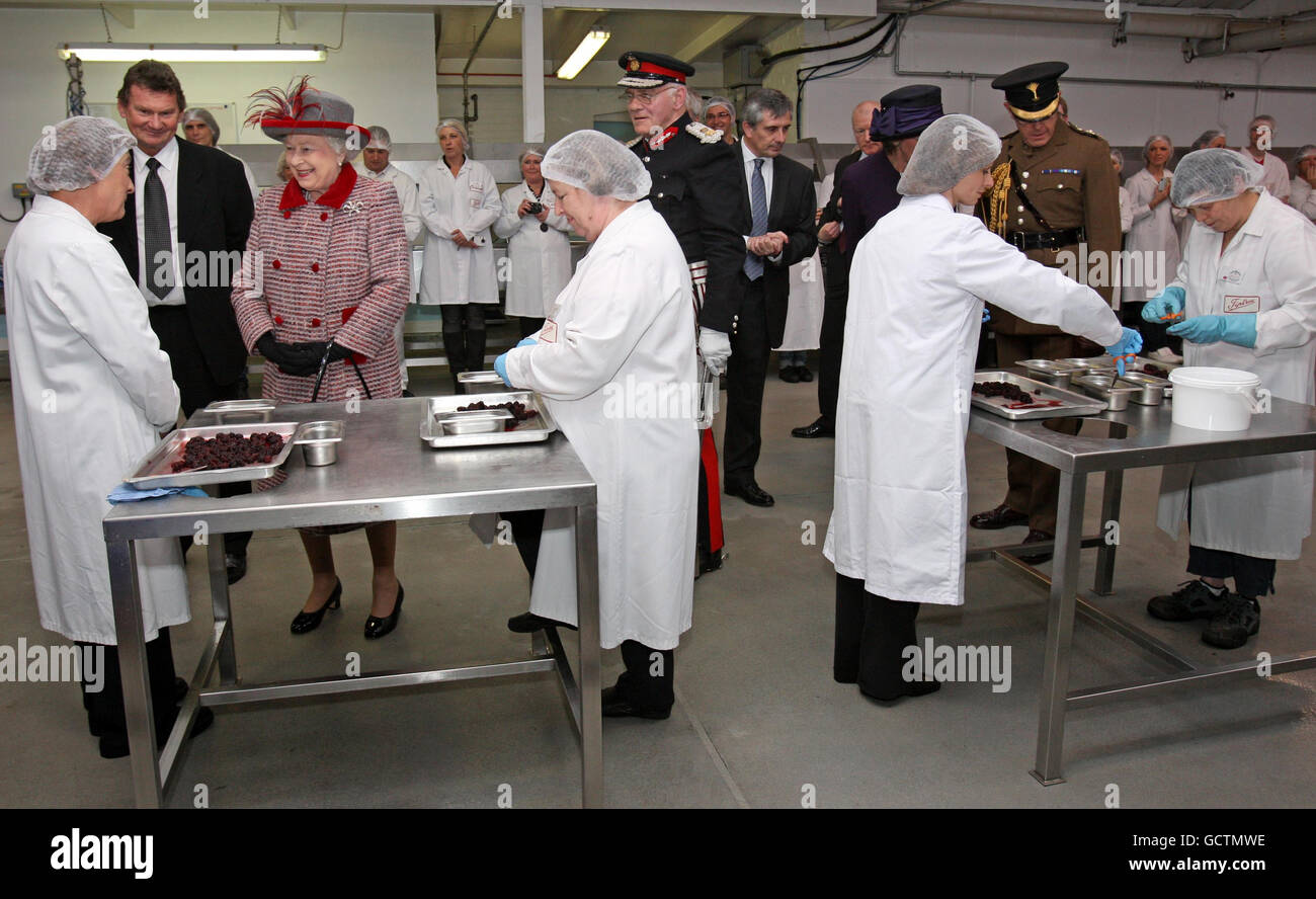 Queen Elizabeth II during a tour of the Wilkin and Son's Jam factory in Tiptree, Essex Stock