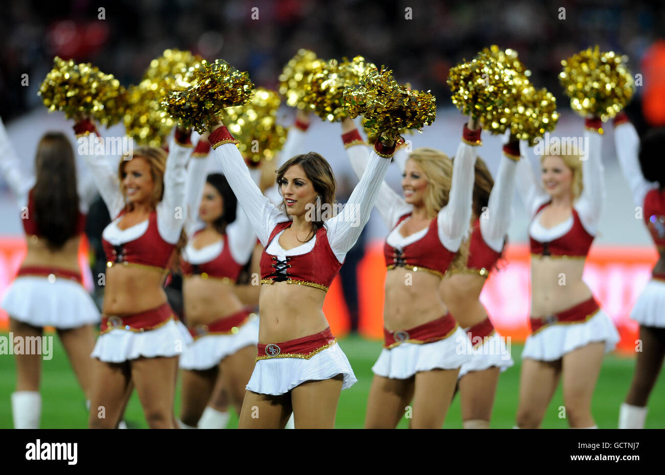 American Football - NFL - San Francisco 49ers v Denver Broncos - Wembley Stadium. San Francisco's Gold Rush cheerleaders entertain the crowd Stock Photo