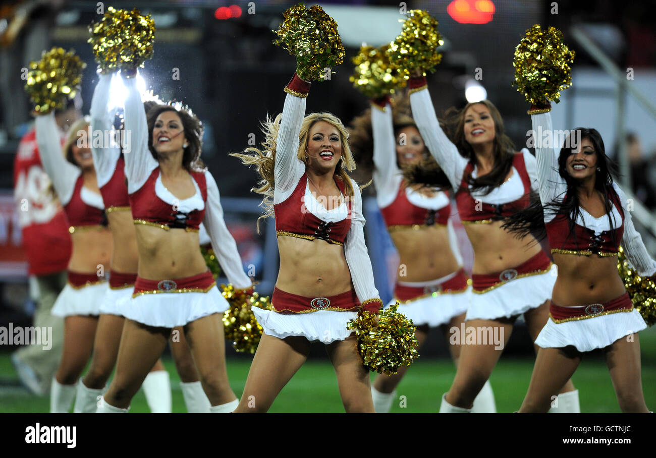 American Football - NFL - San Francisco 49ers v Denver Broncos - Wembley Stadium. San Francisco's Gold Rush cheerleaders entertain the crowd Stock Photo