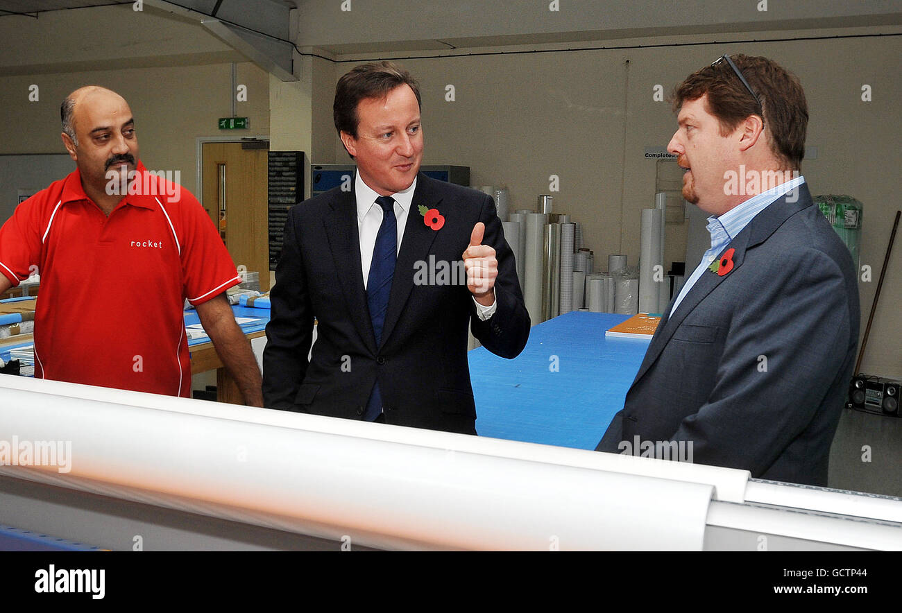 Prime Minister David Cameron talks to Oliver Bridgeman (right) of Rocket Graphics Ltd, during a visit to Croxley Green Business Park, Watford. PRESS ASSOCIATION Photo. Picture date: Monday November 1, 2010. Photo credit should read: John Stillwell/PA Wire Stock Photo