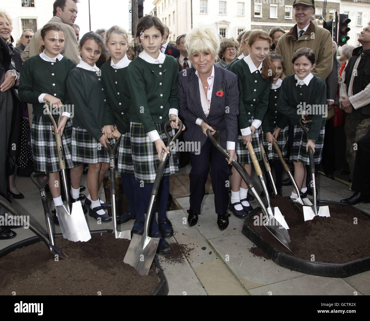 Barbara Windsor is joined by pupils from Queens College Prep School during the unveiling of the central London tree planting scheme in Marylebone, central London. PRESS ASSOCIATION Photo. Picture date: Thursday November 4, 2010. The event is part of a joint initiative between Westminster City Council, Westminster Tree Trust and the W1W Tree Planting Initiative. Photo credit should read: Yui Mok/PA Wire Stock Photo