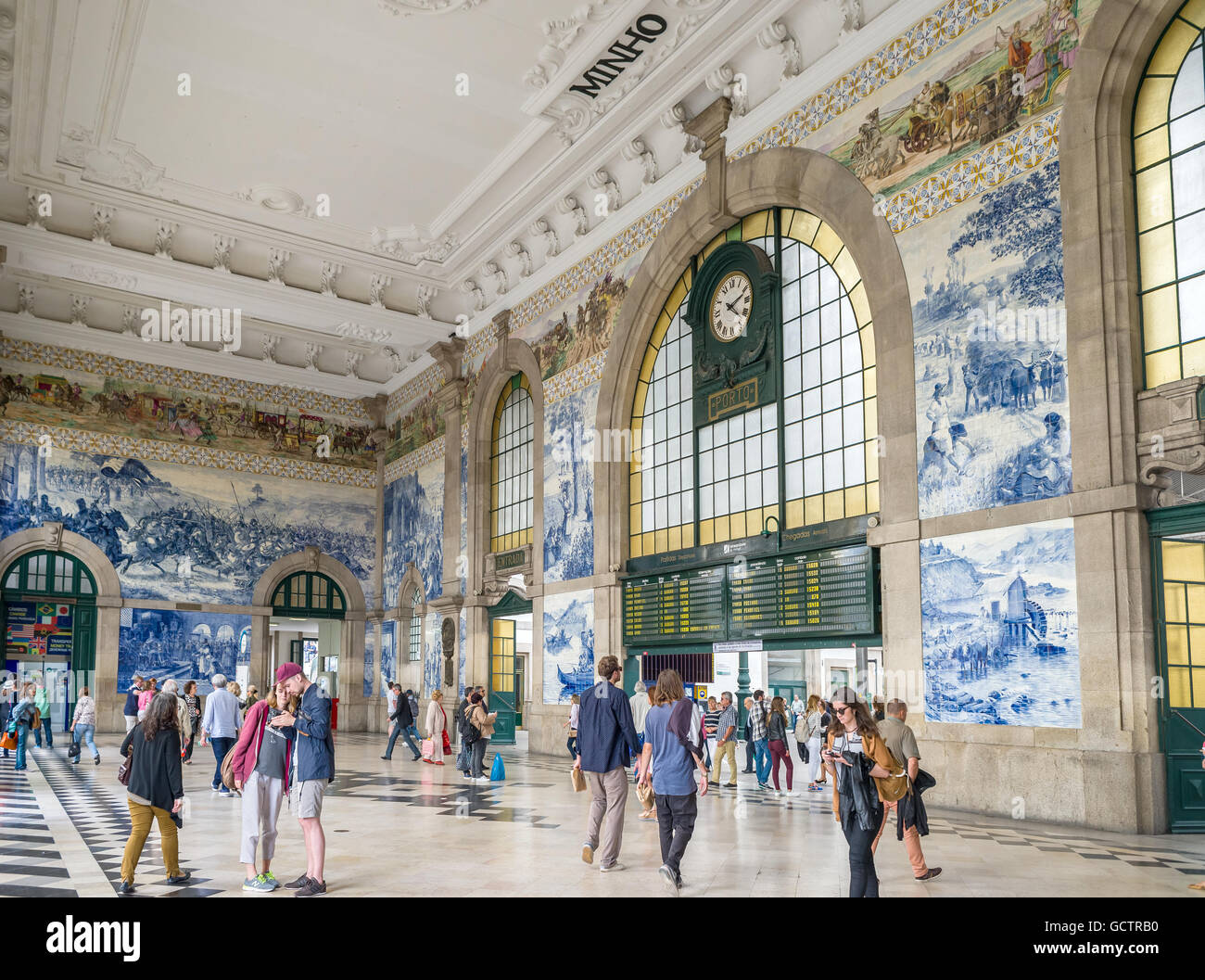 Travellers in the interior of the historical Sao Bento train station in Porto, Portugal. Stock Photo
