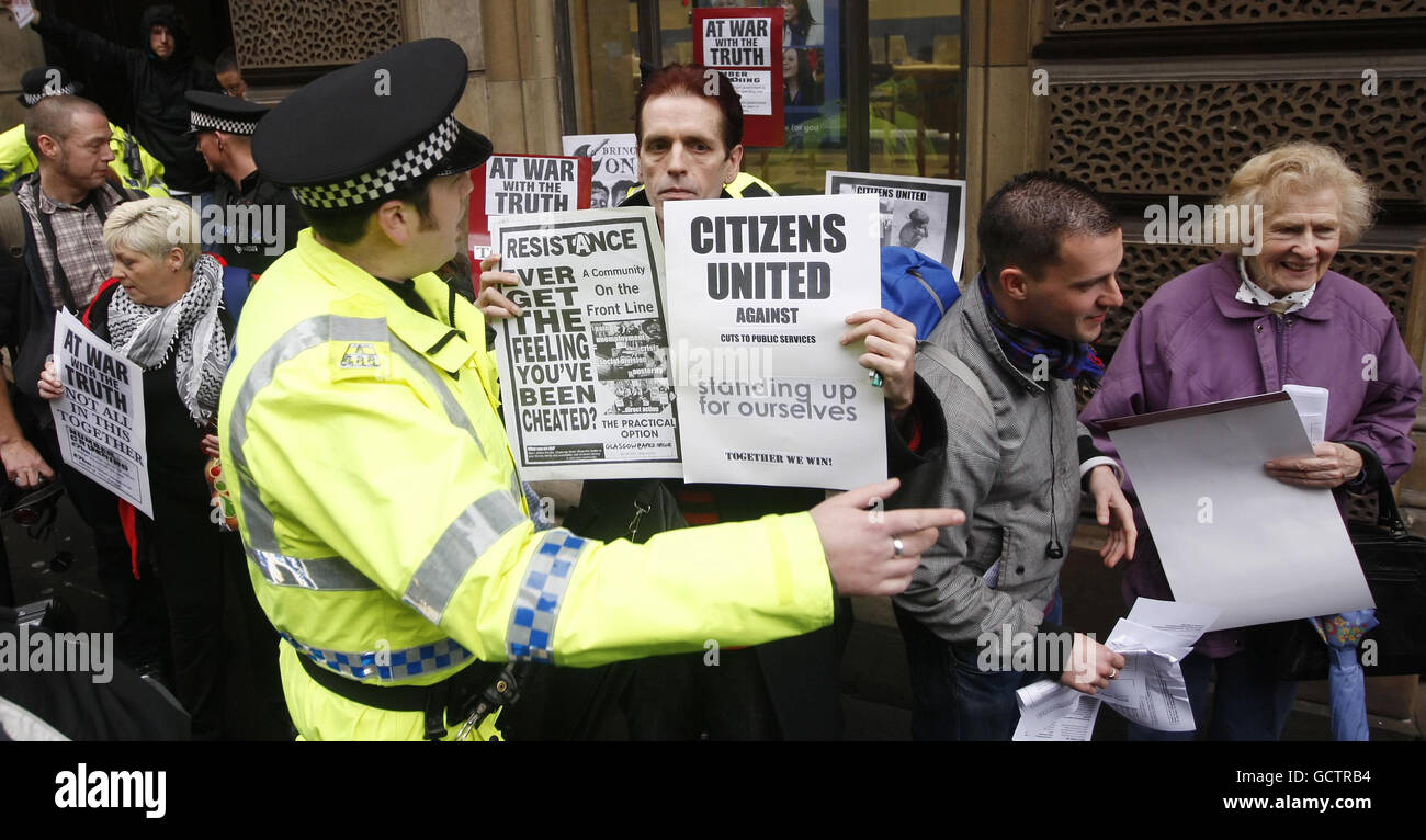 Members of community campaign group Citizens United outside a branch of the Royal Bank of Scotland in Glasgow following an occupation of the bank by the group. Stock Photo