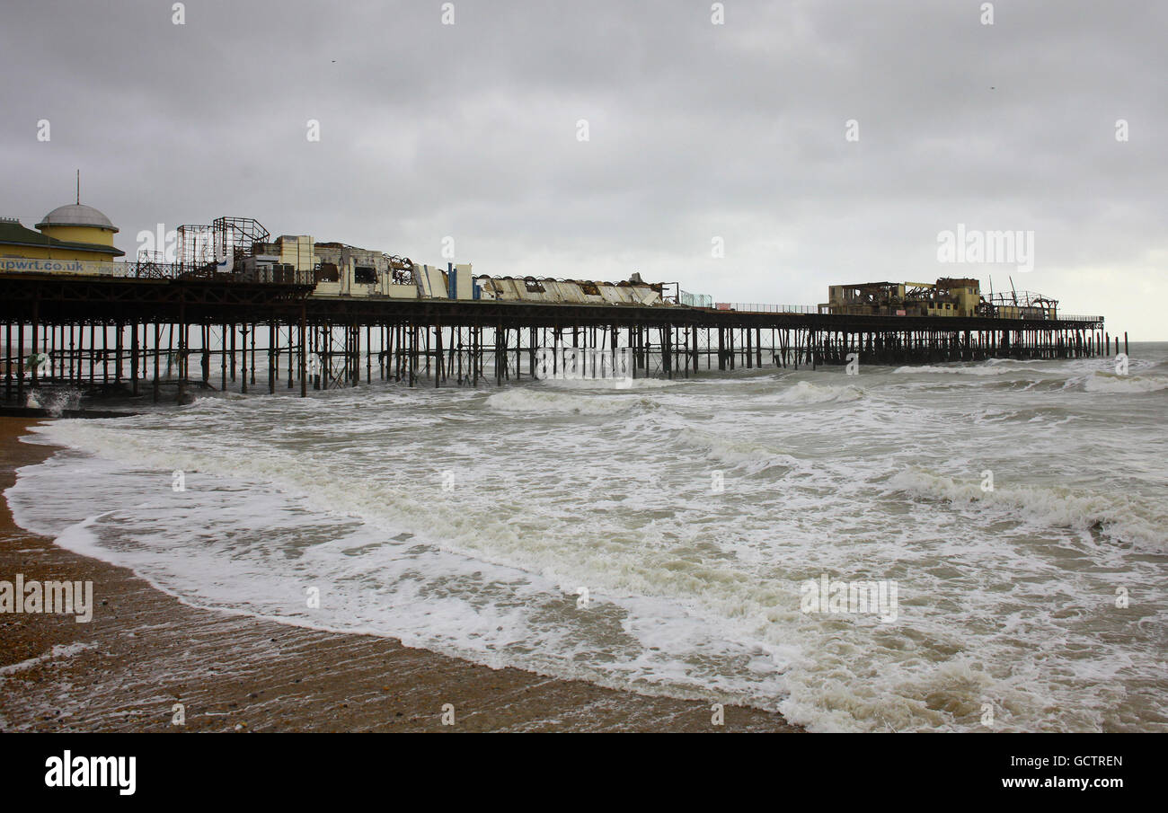 A general view as demolition workers start to dismantle unsafe sections of Hastings Pier following a suspected arson attack. Stock Photo