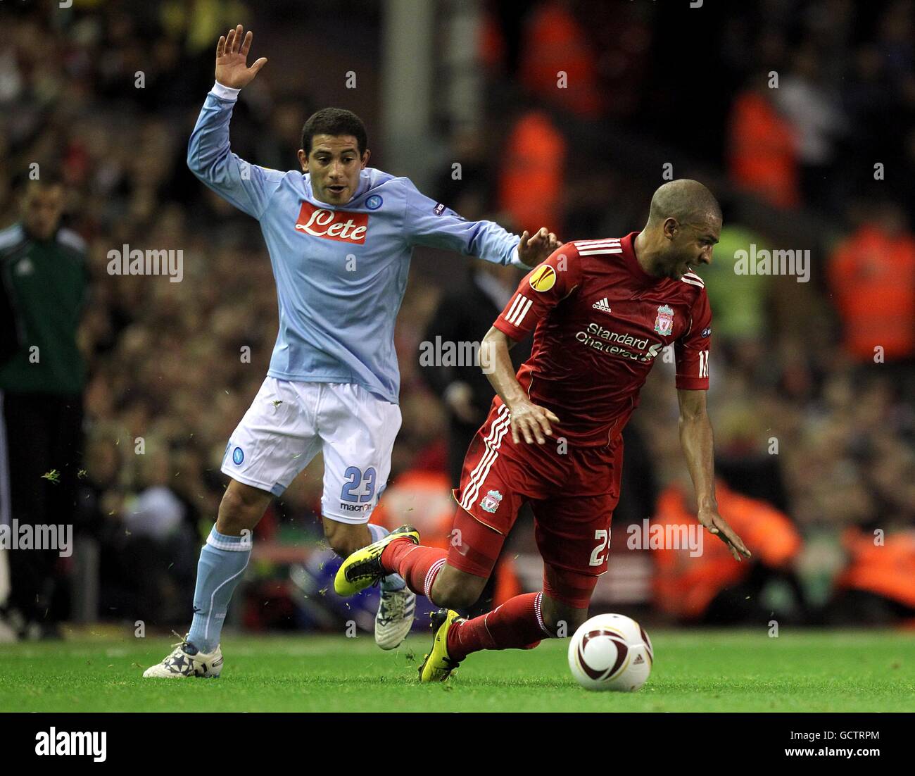 Liverpool's David Ngog (right) and Napoli's Walter Gargano battle for the ball Stock Photo