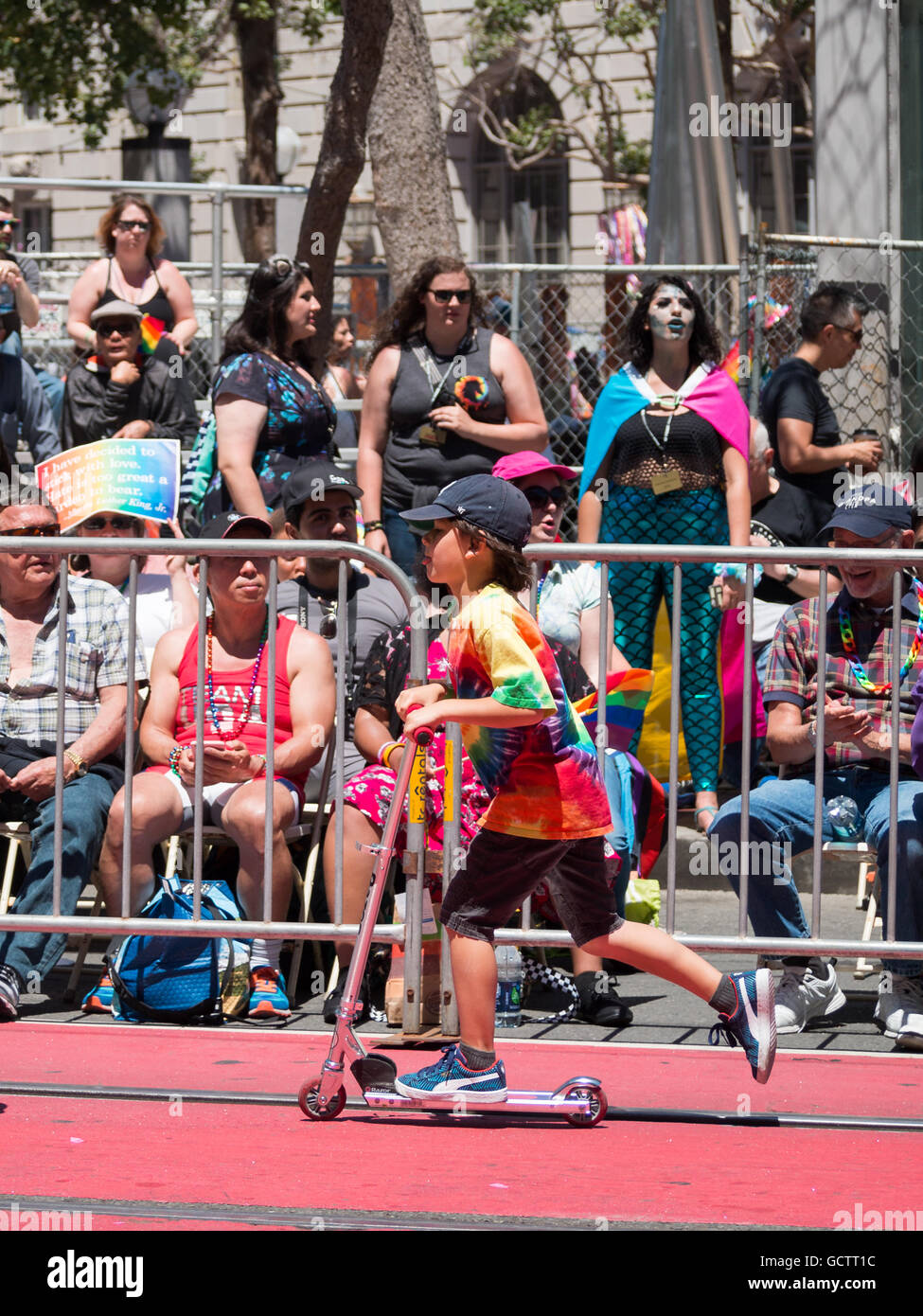 A kid a scooter in San Francisco Pride Parade 2016 Stock Photo - Alamy
