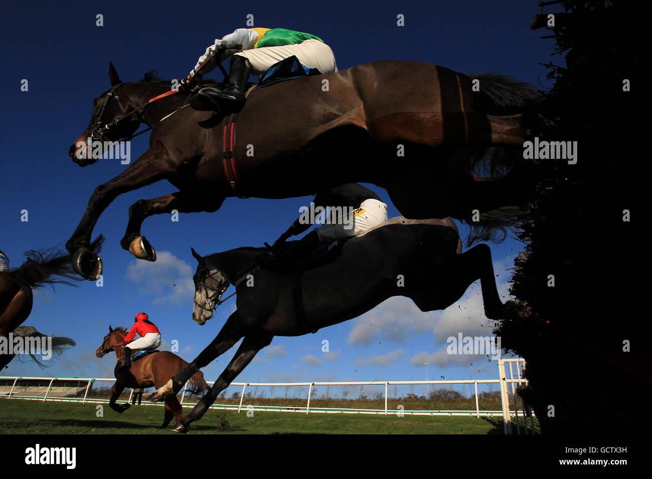 Horse Racing - Newcastle Racecourse. Tippering ridden by Tjade Collier jumps the last in The WSR Novices' Hurdle Race Stock Photo