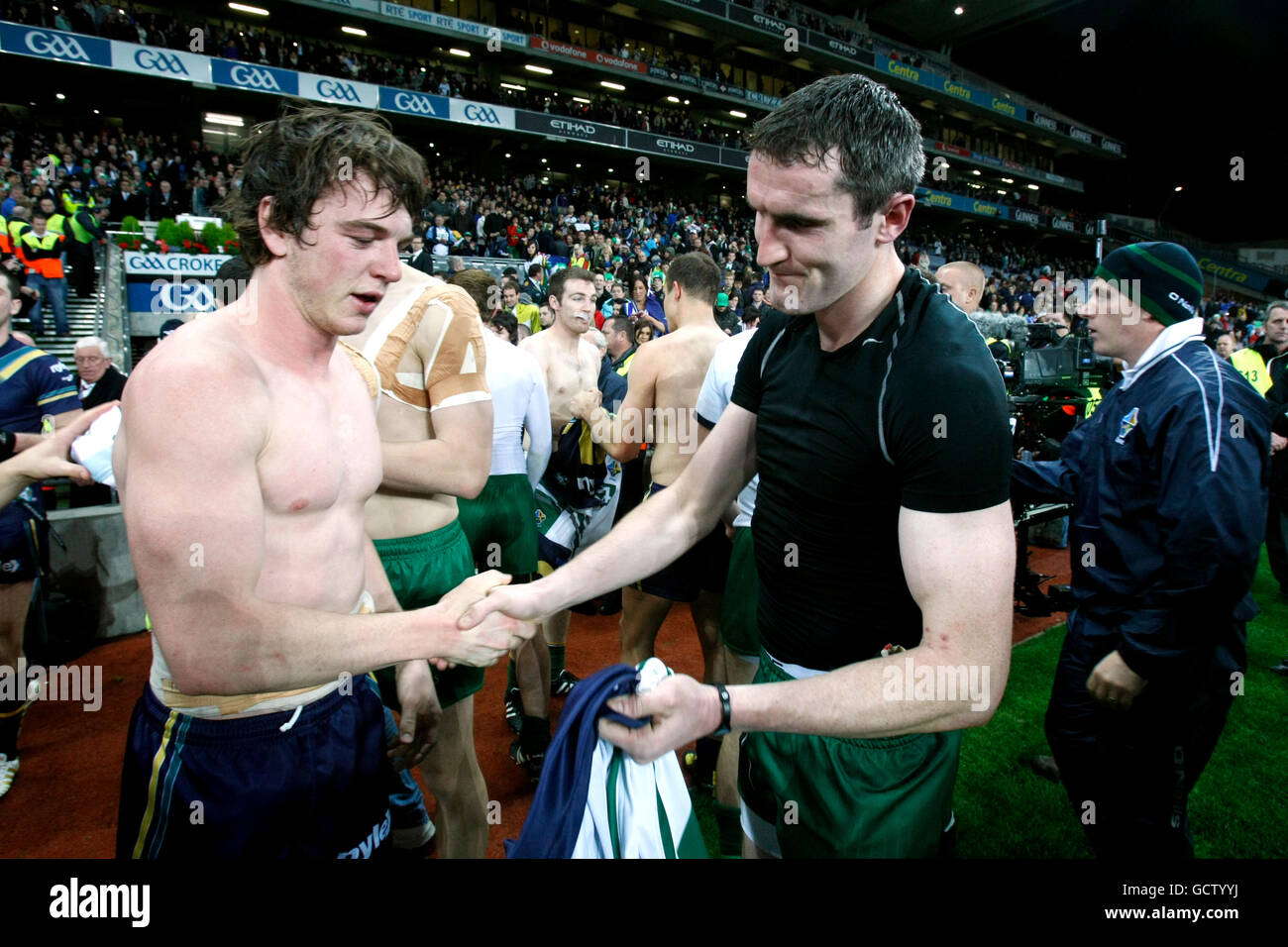Players swap shirts at the end of the game hires stock photography and