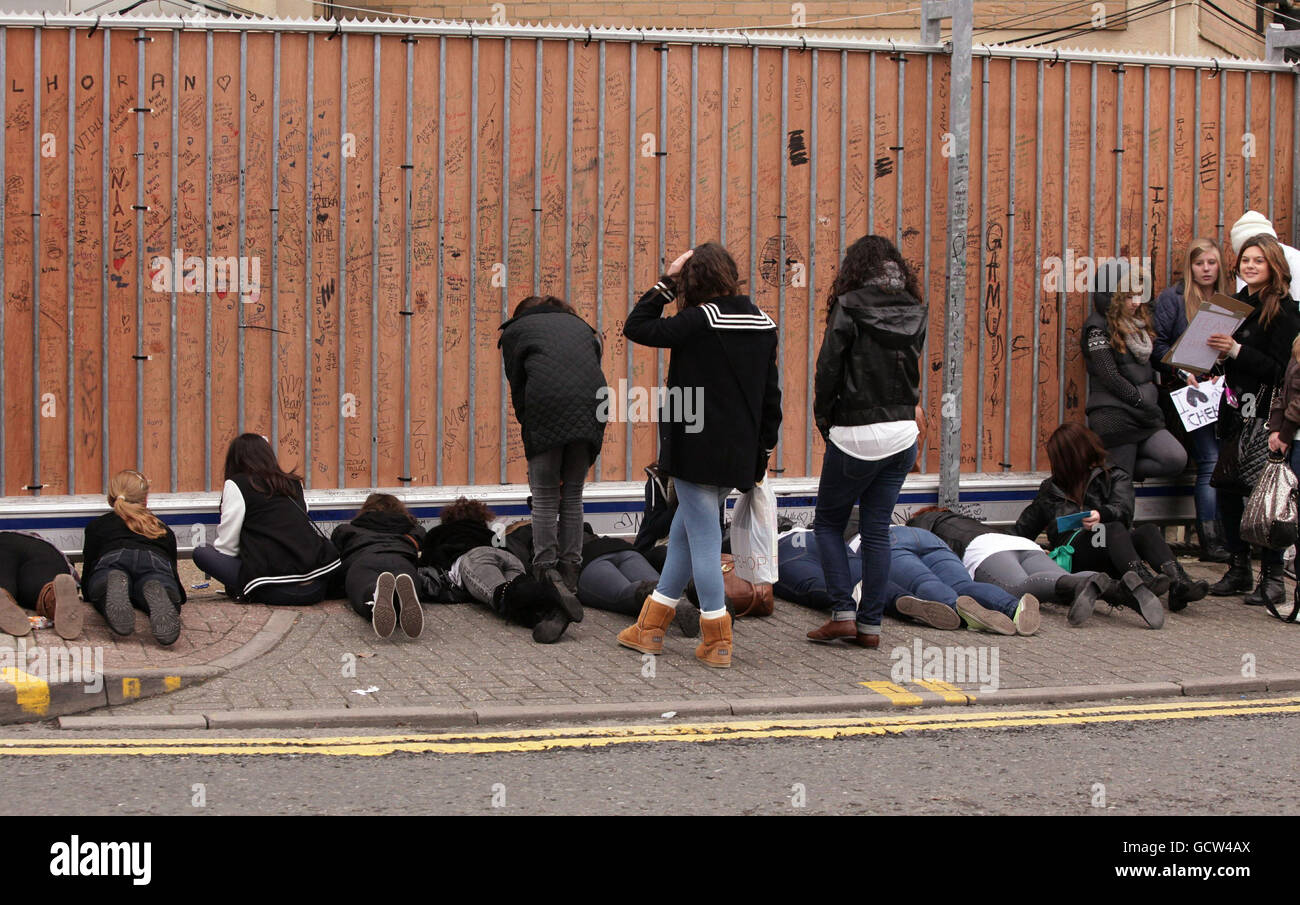Fans wait outside Fountain Studios in Wembley, ahead of the X Factor show this evening Stock