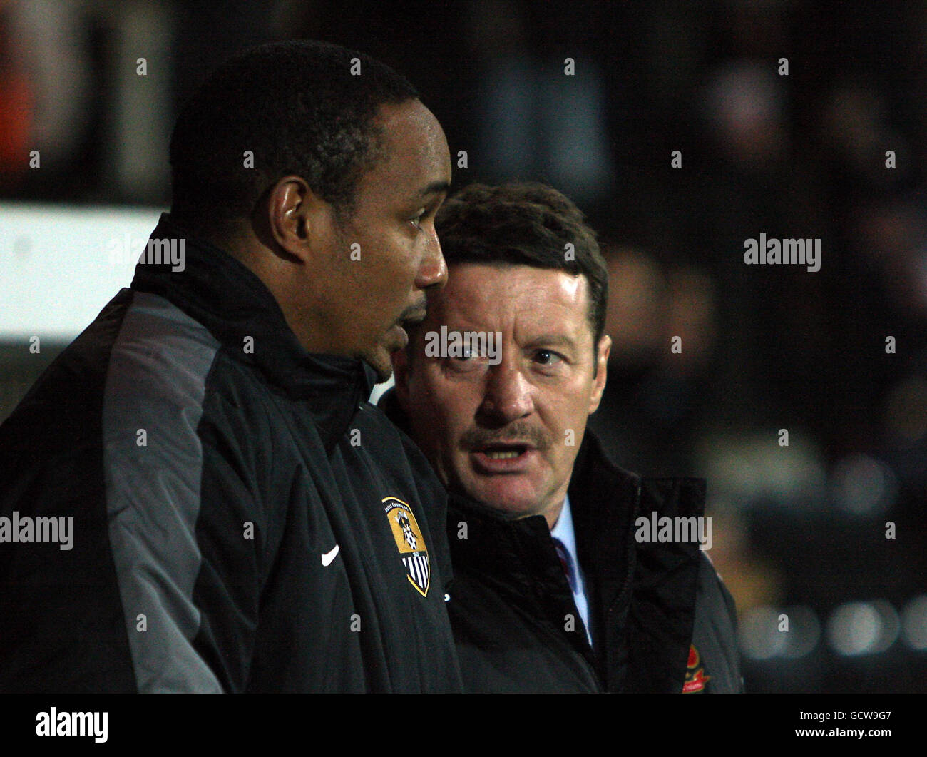 Notts County manager Paul Ince (left) and Swindon Town manager Danny Wilson in conversation on the touchline during the npower Football League One match at Meadow Lane, Nottingham. Stock Photo