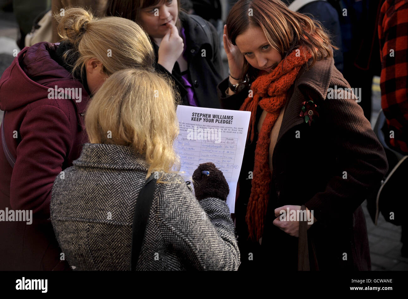 Students sign a form expressing their feelings to Liberal Democrat MP ...