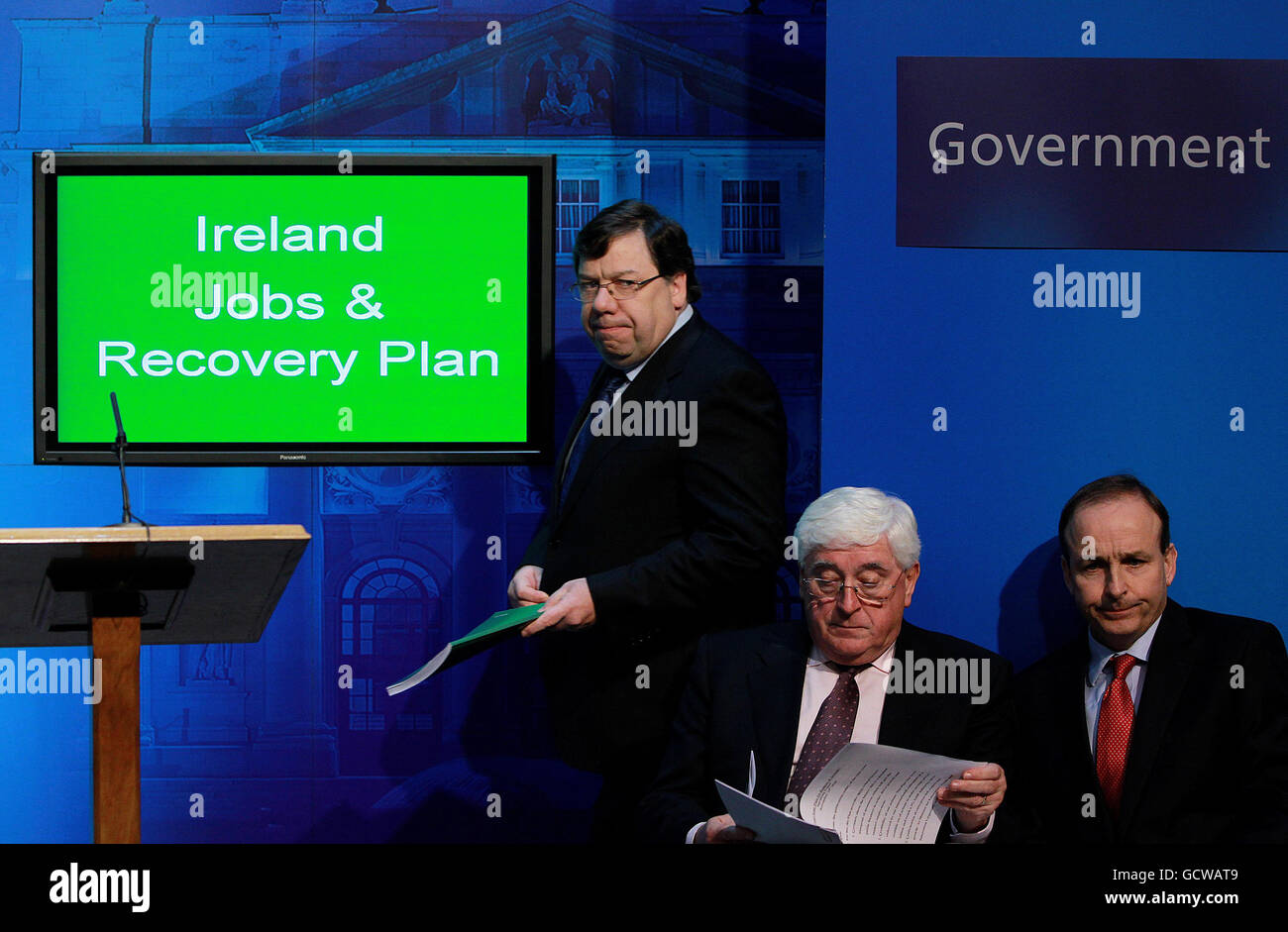 Taoiseach Brian Cowen (left) prepares to announce the National Recovery Plan as Minister for Foreign Affairs Michael Martin (right) and Minister for Enterprise Trade and Innovation Batt O'Keefe look on, in the Government Press Centre in Dublin. Stock Photo
