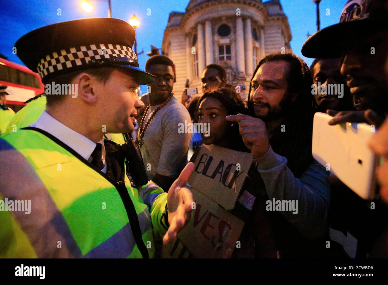 Police on Acre Lane in Brixton, London, as demonstrators protest against the killing of two black men in the United States. Stock Photo