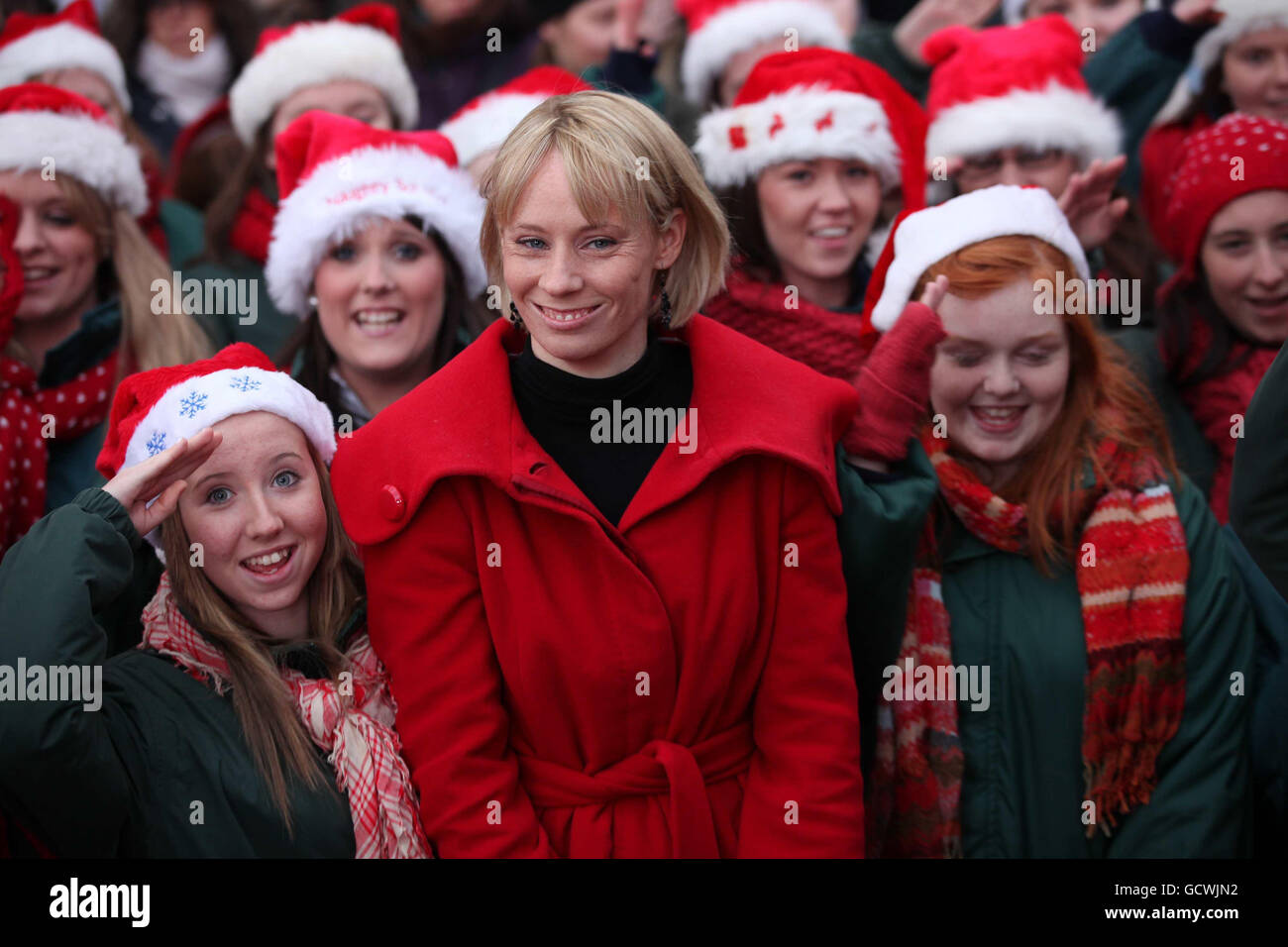 Derval O'Rourke with members of the Ballyphehane Choir from Cork City, as O'Rourke turned on the Christmas lights on Dublin's Grafton Street. Stock Photo