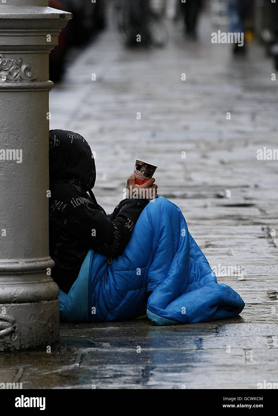 Ireland's financial woes. A begger (name not given) on the pavement