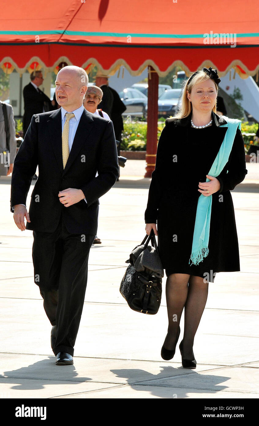 Foreign Secretary William Hague and his wife Ffion walk towards the Royal flight plane, to depart Muscat Airport for home, after they accompanied Queen Elizabeth II and Duke of Edinburgh on a five day State Visit to the Gulf region. Stock Photo