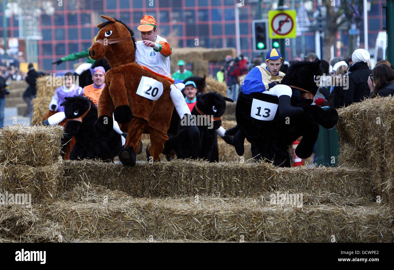 The leaders clear the fourth jump in the Pantomime Horse Grand National held on Broad Street, Birmingham. Stock Photo
