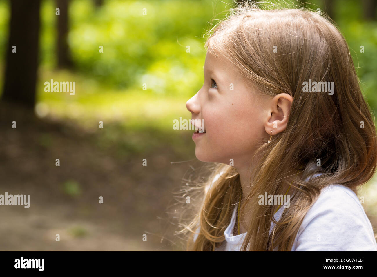 Portrait of beautiful happy little girl summer outdoors Stock Photo