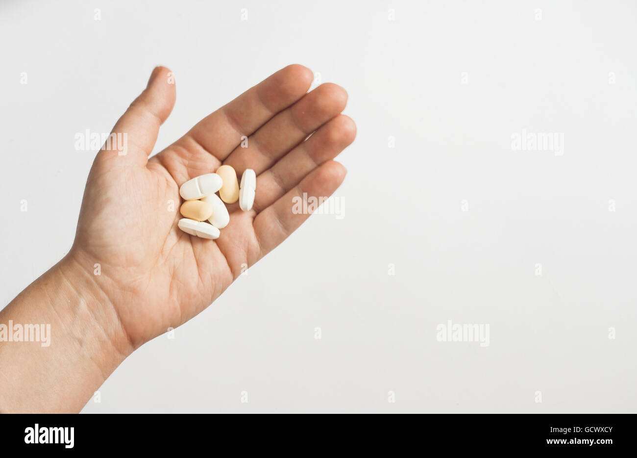 Doctor holding in hand aspirin hi-res stock photography and images - Alamy
