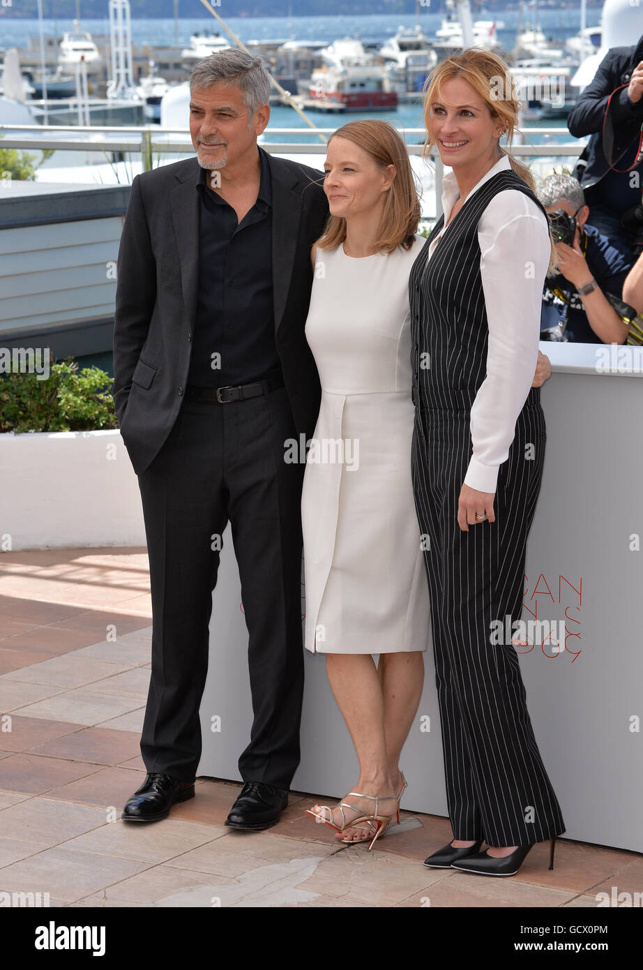 CANNES, FR - MAY 12, 2016: Actress/director Jodie Foster & actors George Clooney & Julia Roberts at the photocall for 'Money Monster' at the 69th Festival de Cannes. Stock Photo