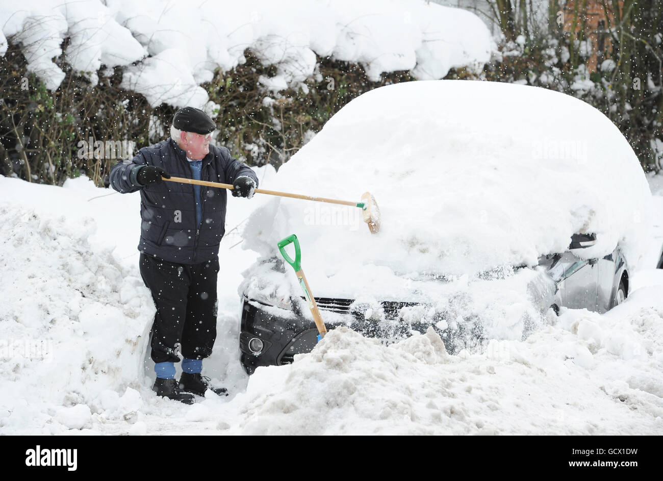 Cars completely buried after the worst snow since 1974 fell on Alnwick in Northumberland. Stock Photo