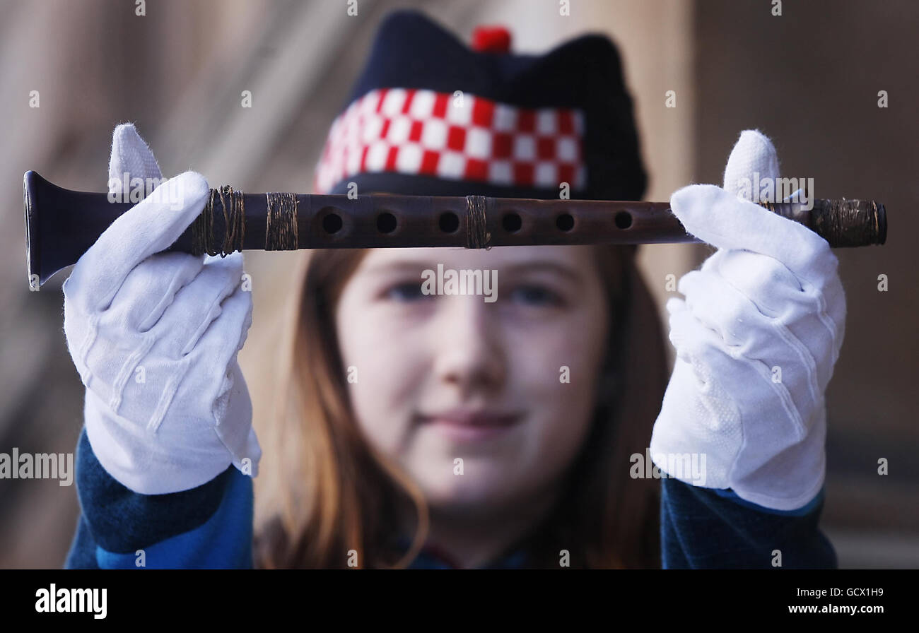Grace Welden, distant relative of Iain Dall MacKay, holds the oldest known Highland bagpipe chanter at its new home in the National Piping Centre in Glasgow. Stock Photo