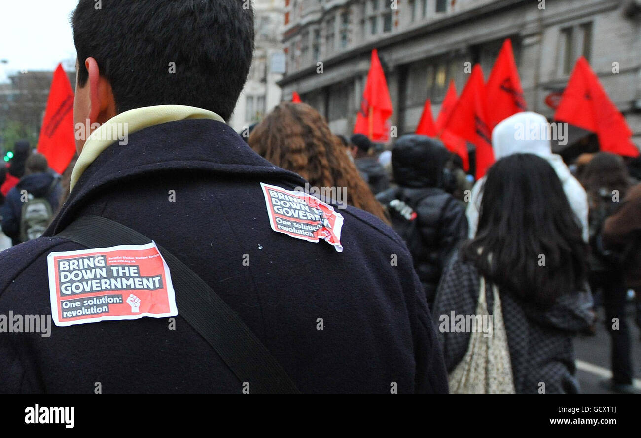 Increase in tuition fees. Stickers on the back of a participant in a student march against university fees, in central London. Stock Photo