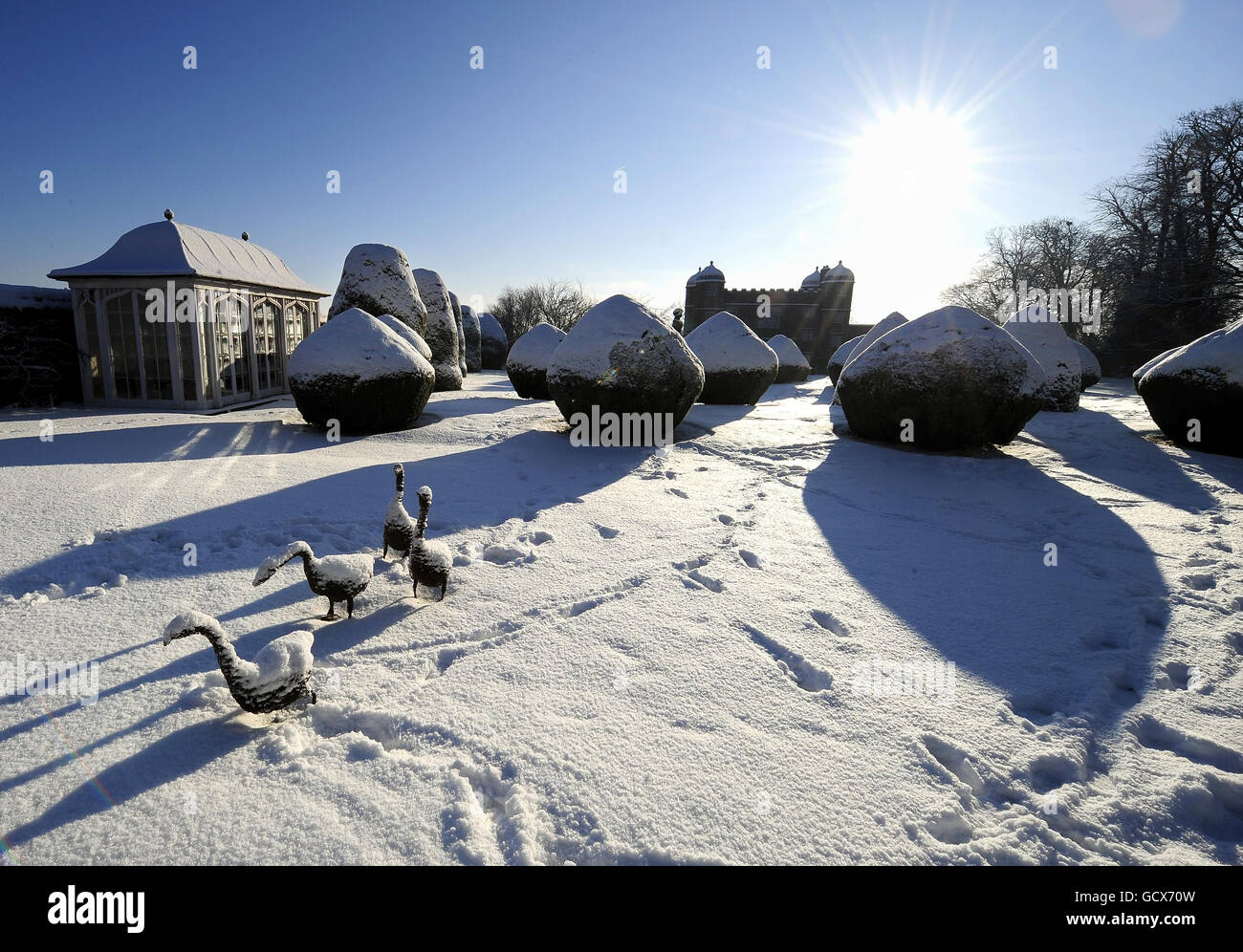 A wintery scene in the gardens of Burton Agnes Hall in East Yorkshire, as heavy snow continues to fall in eastern and northern parts of the UK. Stock Photo