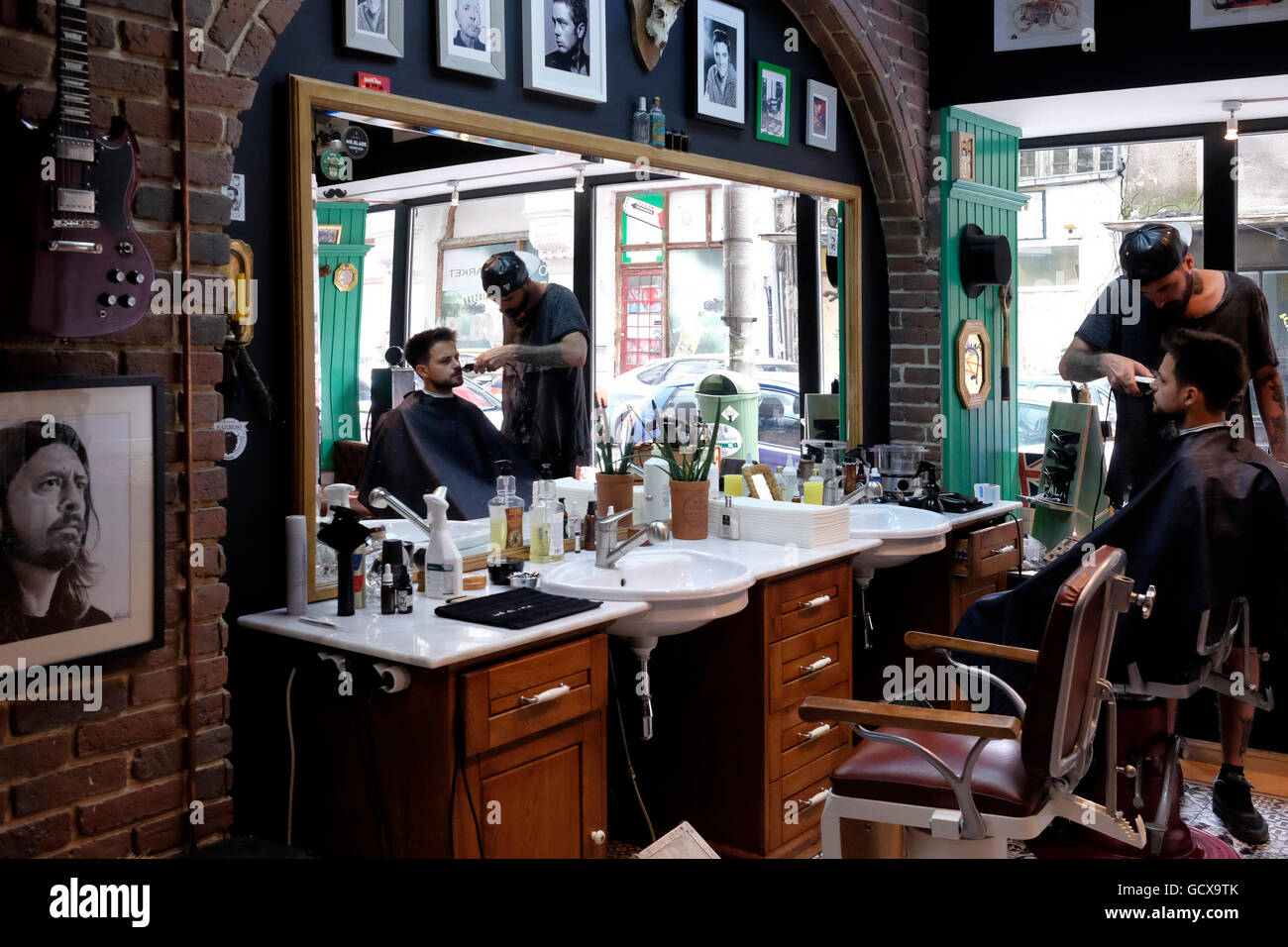 A barber at work in Mr. Blade barber shop in central Bucharest Romania