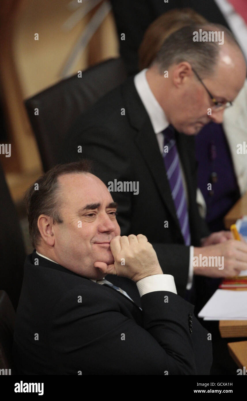 Finance Secretary John Swinney (right) talks to the Scottish Parliament in Edinburgh, as Alex Salmond looks on. Stock Photo