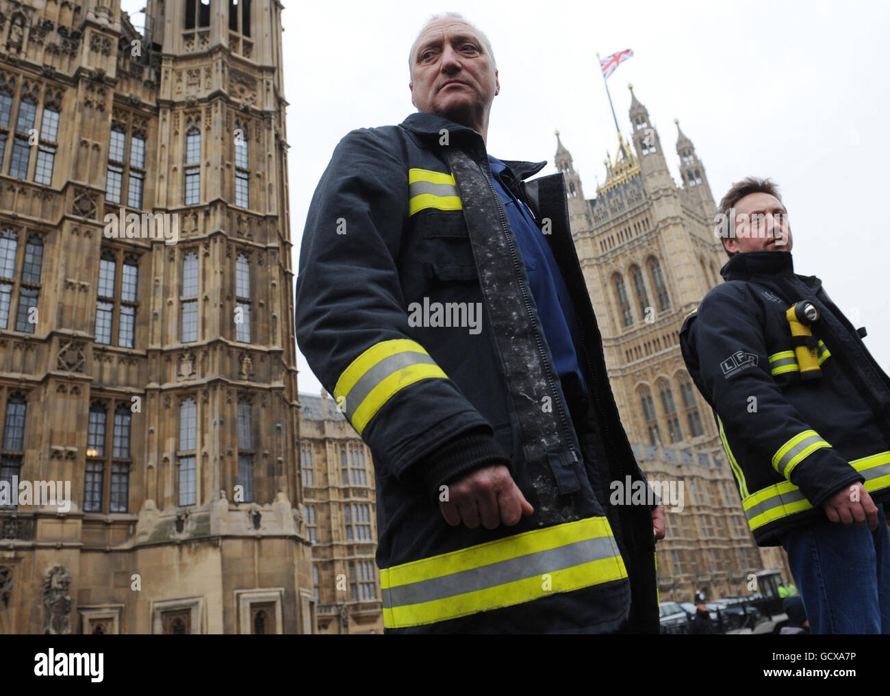 Firefighters demonstrate outside Parliament in London to lobby MPs as part of a campaign to protect pay, pensions and conditions, pledging the 'fight of our lives'. Stock Photo