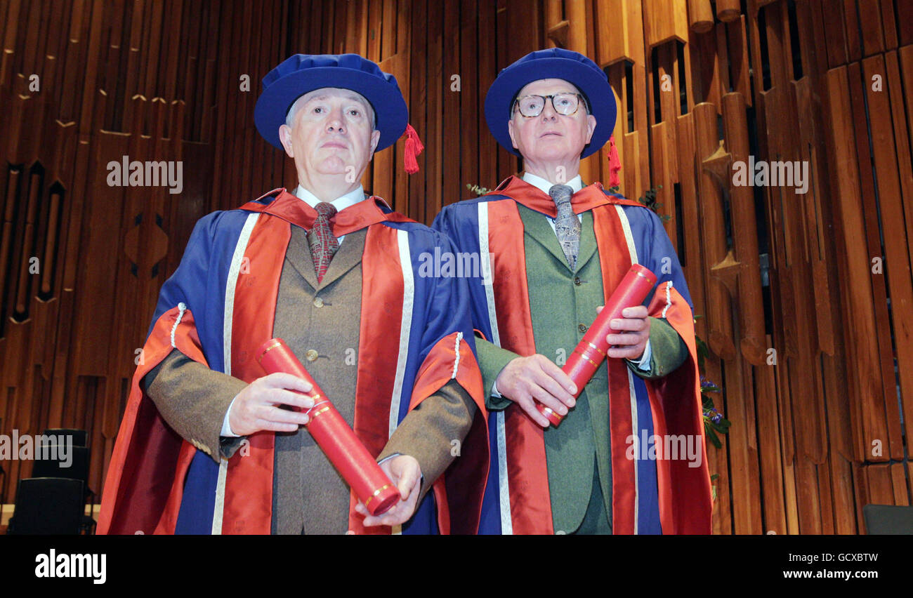 Artists Gilbert Proesch (left) and George Passmore (right) also known as Gilbert and George receive honorary doctorates from the University of East London at a ceremony at the Barbican centre. Stock Photo