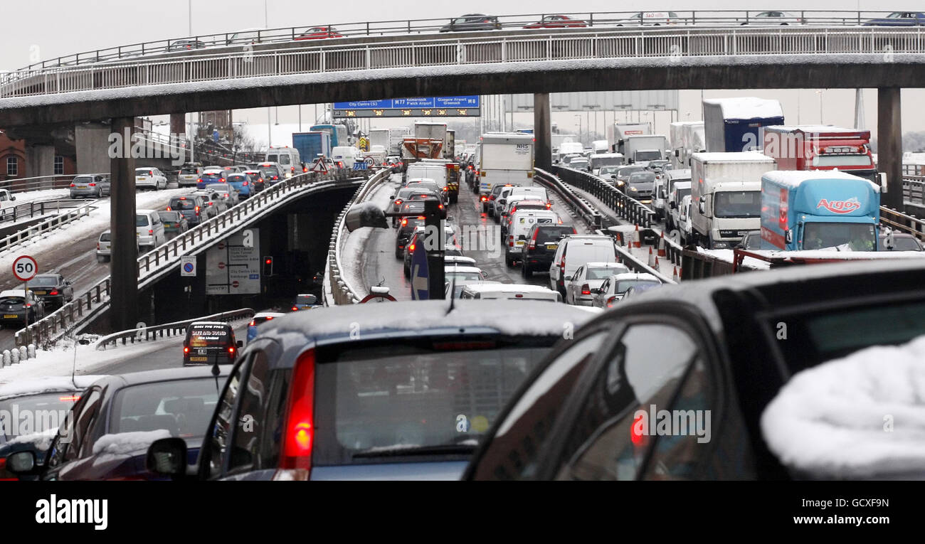 Traffic queuing on the M8 in Glasgow as heavy snow continues to cause travel chaos in Scotland. Stock Photo