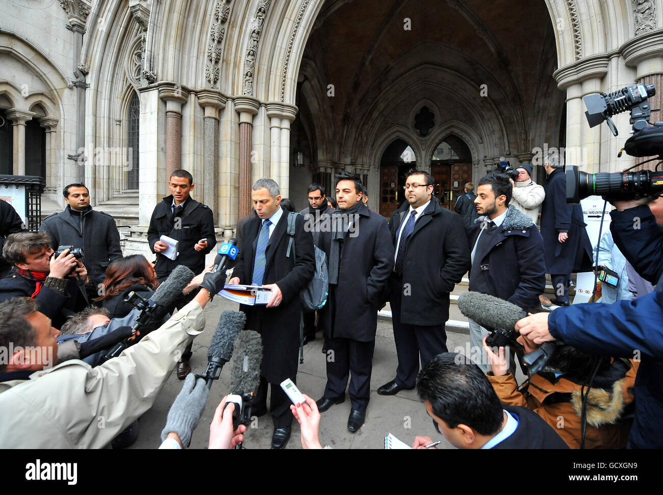 Andrew Katzen, solicitor for Shrien Dewani, reads a statement on behalf of relatives outside the Royal Courts of on their behalf. Stock Photo