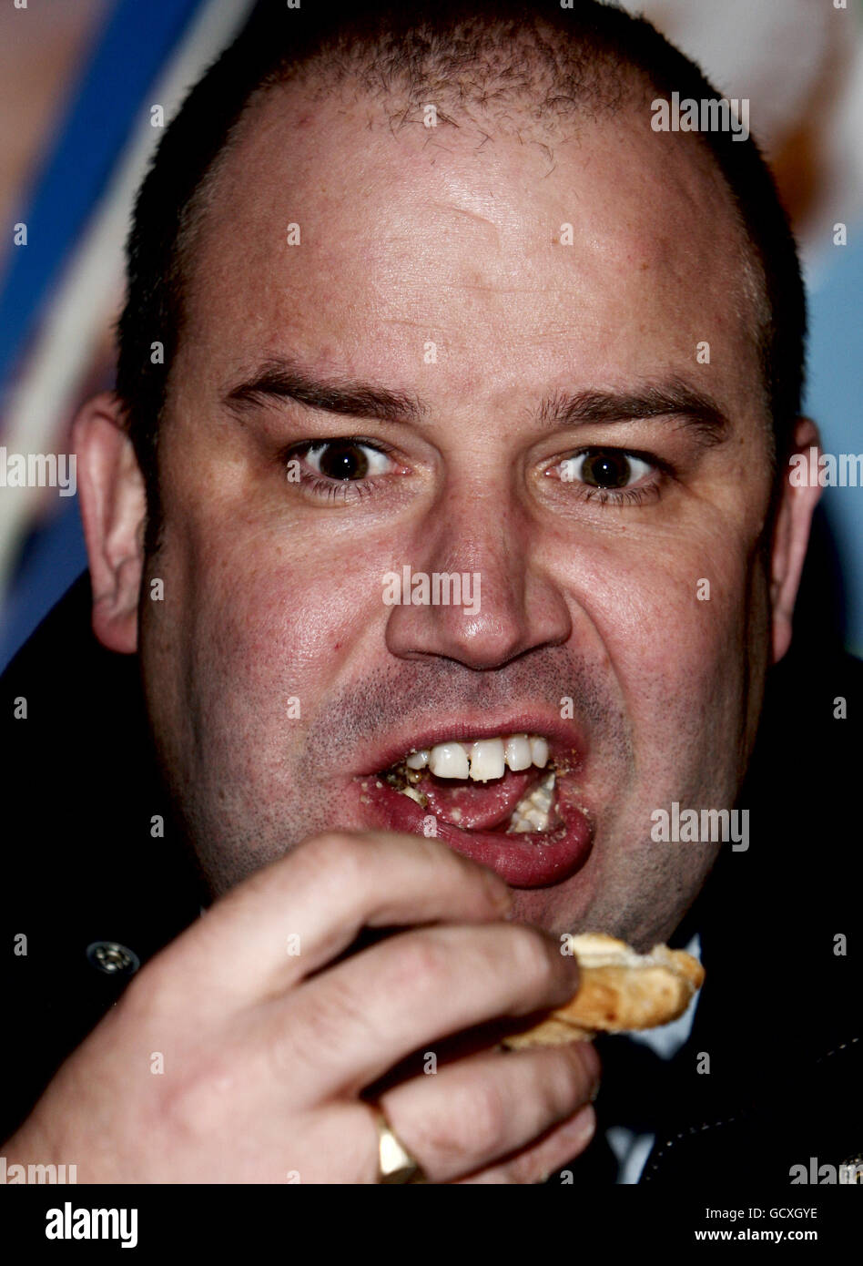 Contestant Dickie Dodd attacks the mince pie with venom during this afternoon's World Record attempt at eating three mince pies (minimum diameter 2.5 inches) in the fastest time, the current record stands at an impressive 1min26seconds. Stock Photo