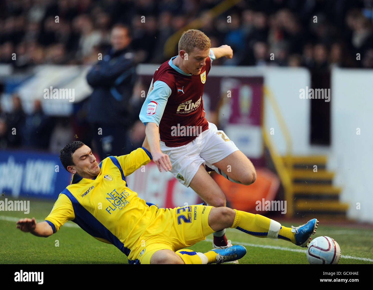 Burnley's Brian Easton (top) battles for the ball with Leed's Robert Snodgrass during the npower Football League Championship at Turf Moor, Burnley. Stock Photo
