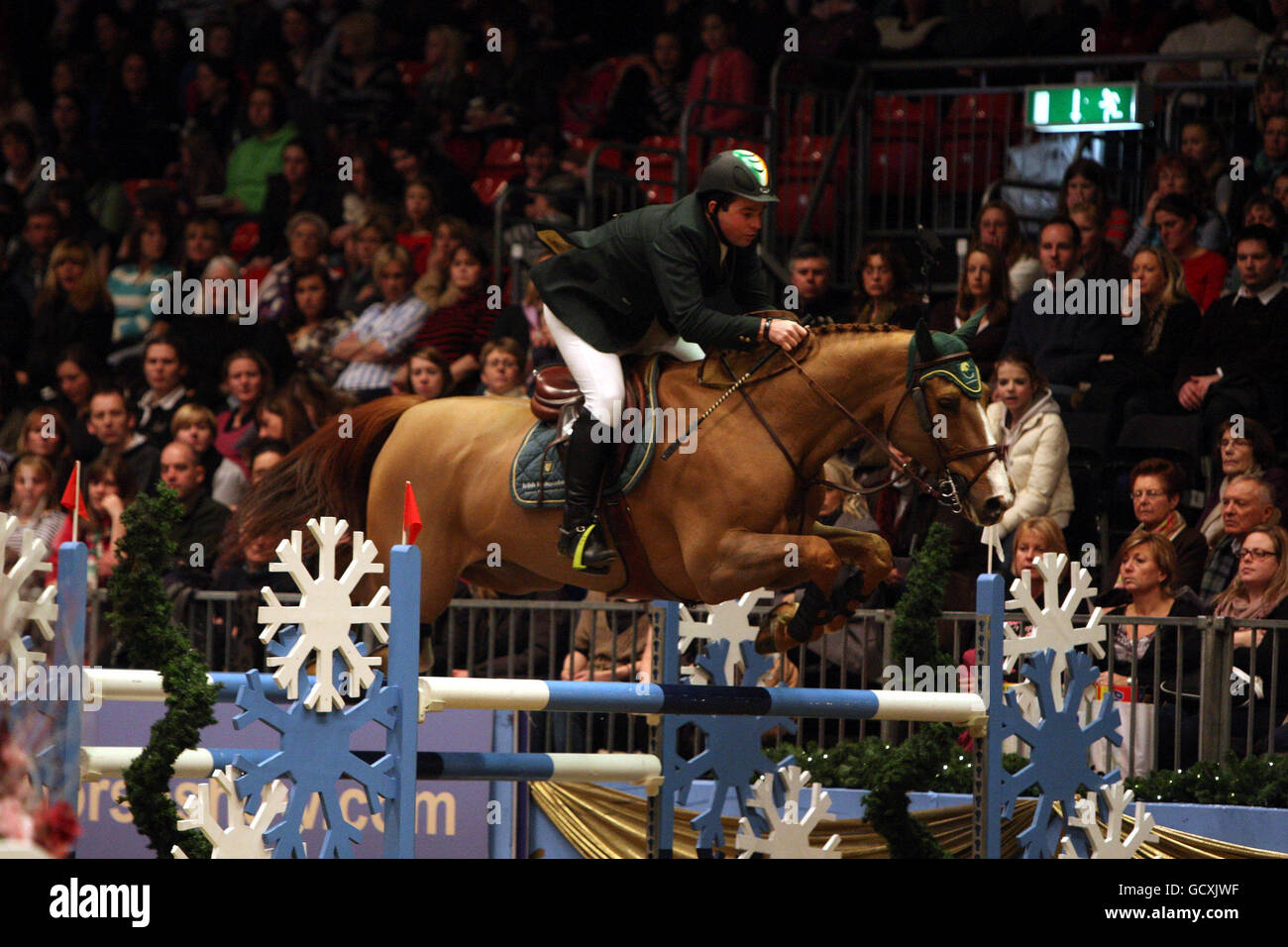 Ireland's Cian O'Connor riding Splendor 2 wins the Santa Stakes during the London International Horse Show at the Olympia Exhibition Centre, London. Stock Photo