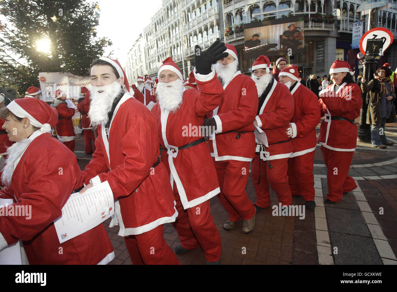 Some of the 100 singing Santa members of the website community www.movieextras.ie on Dublin's Grafton Street, raising money for 4 charities: St Vincent de Paul, AWARE, Kidane Mehret and St Lukes Hospital. Stock Photo