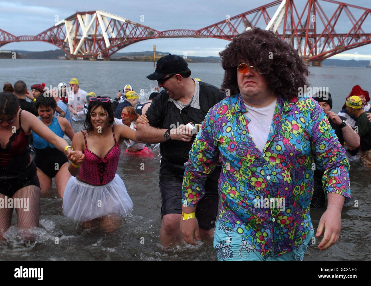 Swimmers brave the cold in the River Forth near Edinburgh, during the Loony Dook, one of the annual New Year's day swims that take place around the UK. Stock Photo