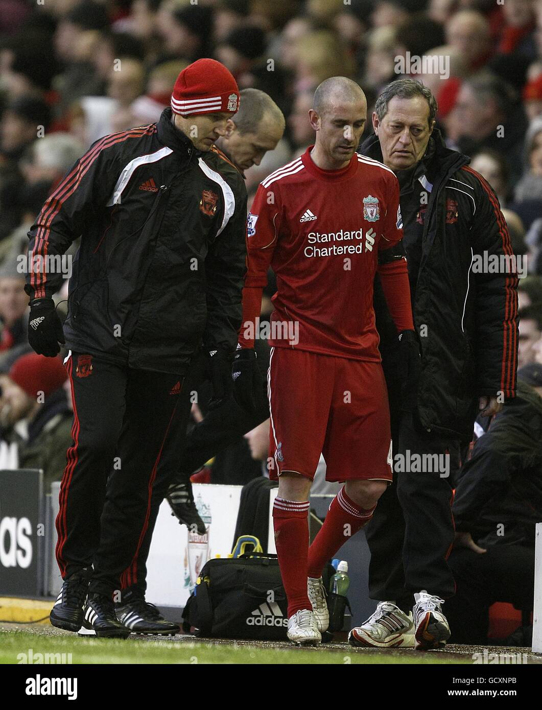 Soccer - Barclays Premier League - Liverpool v Bolton Wanderers - Anfield. Liverpool's Raul Meireles (centre) walks off the pitch after suffering an injury Stock Photo
