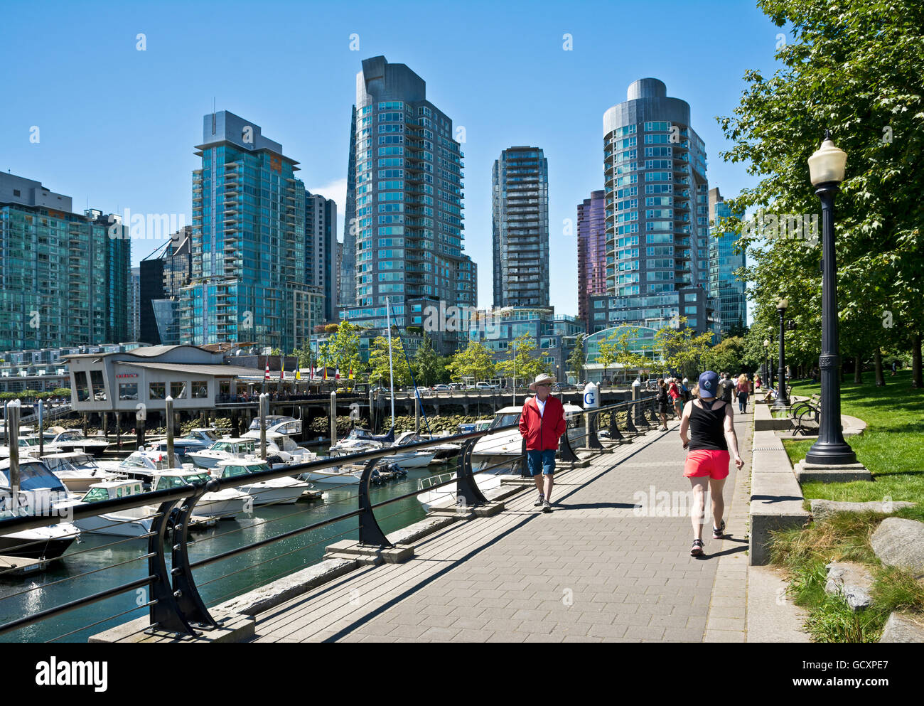 People Walking Along Seawall In Coal Harbour Neighbourhood Of Vancouver Canada Vancouver City Skyline And Waterfront Stock Photo Alamy