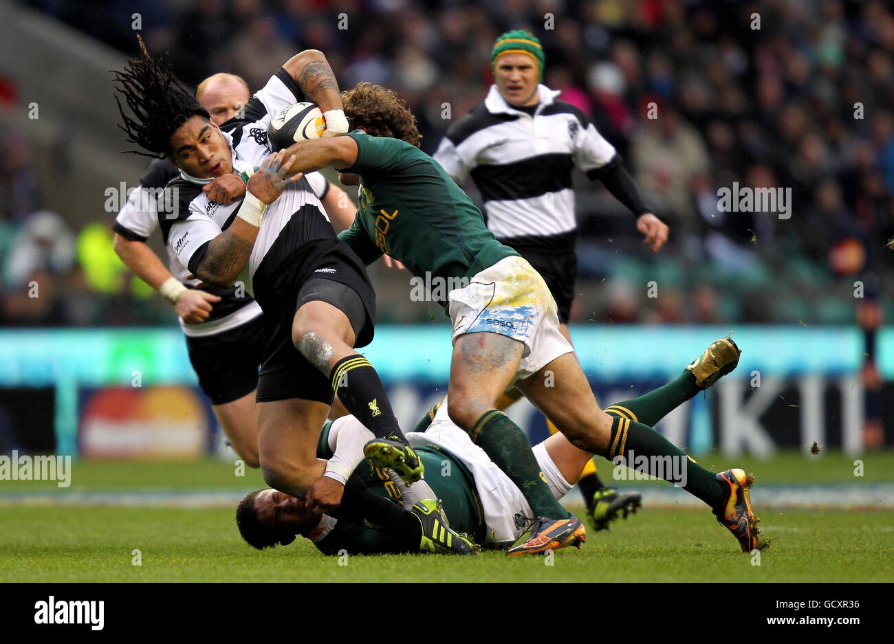 Barbarians Ma'a Nonu is tackled by South Africa's Elton Jantjies and Andries Strauss during The MasterCard Trophy match at Twickenham Stadium, London. Stock Photo