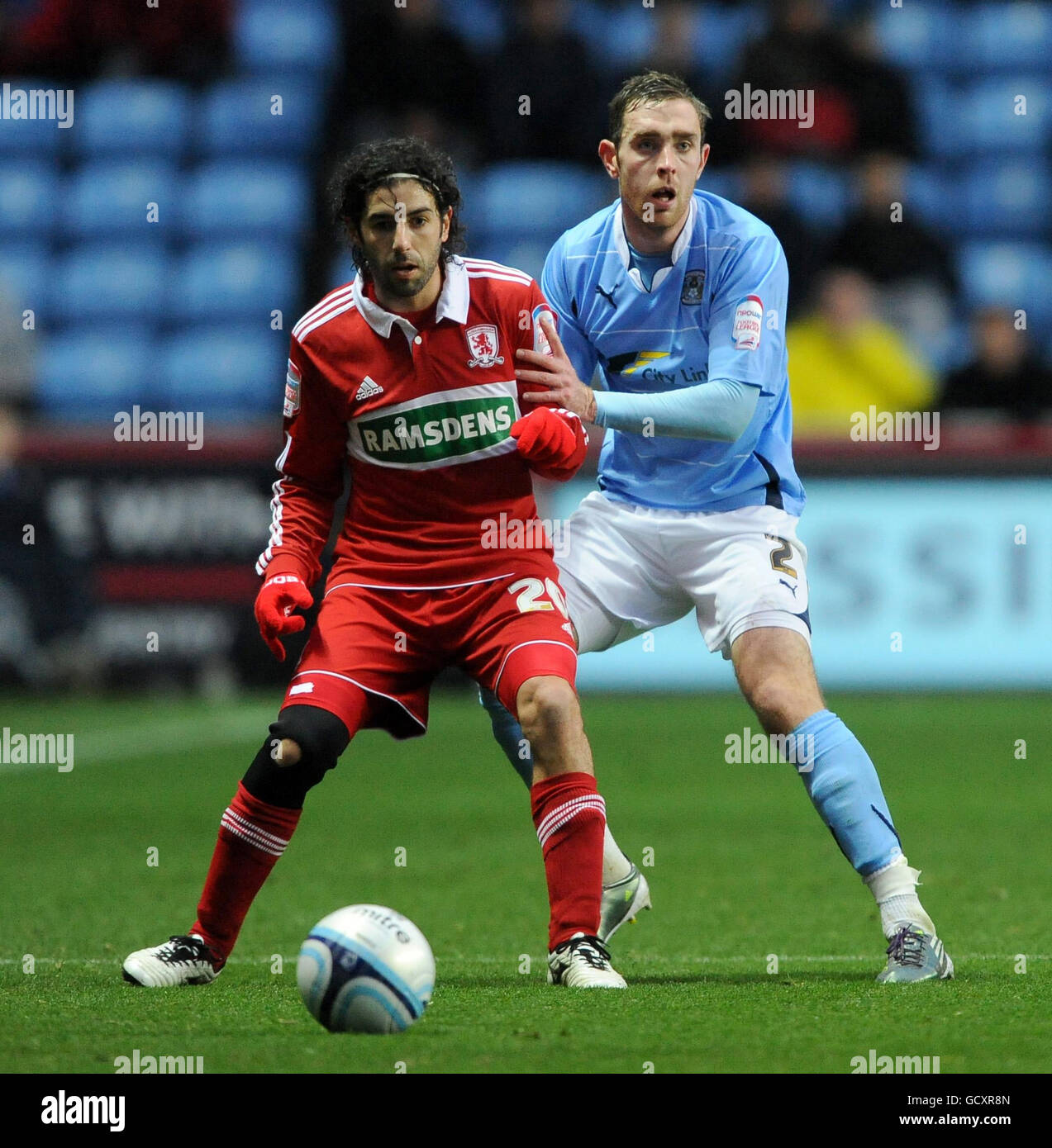 Middlesbrough's Julio Arca and Covetry's Richard Keogh battle for the ball during the npower Football League Championship match at the Ricoh Arena, Coventry. Stock Photo