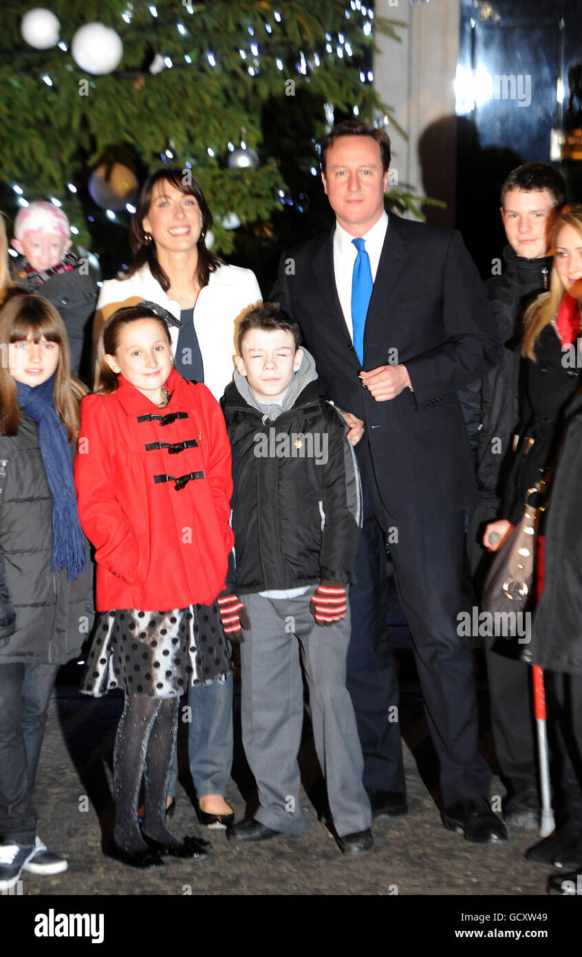 Prime Minister David Cameron and wife Samantha with Blue Peter badge