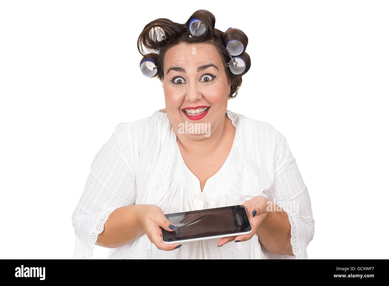 overweight woman housewife holds broken tablet in hands Stock Photo