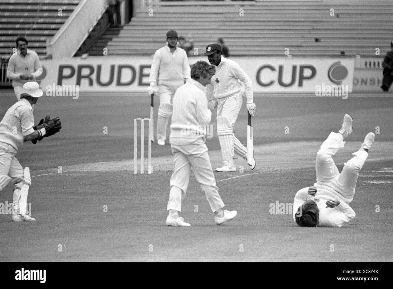 England's Ian Botham, on his back gets the congratulations of captain Mike Brearley as he catches out Canadian opener Glen Sealy off the bowling of Mike Hendrick. Stock Photo
